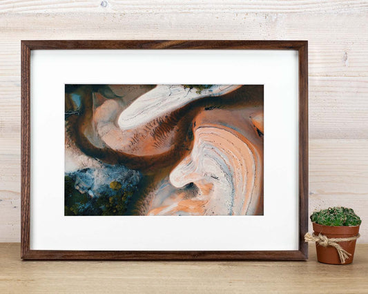 9 pieces custom walnut frames with white mat.