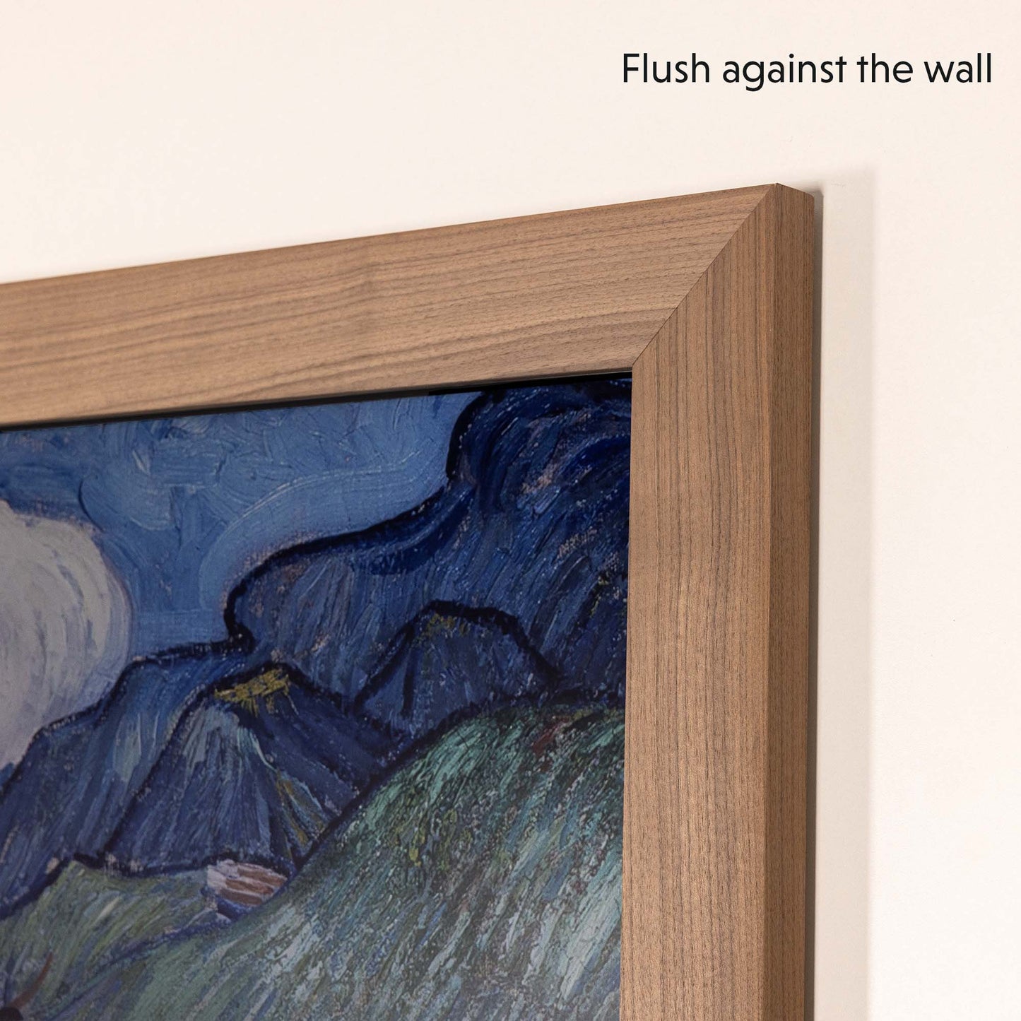 Mounted walnut tv bezel on Samsung The Frame 65 inch TV flushes against the wall