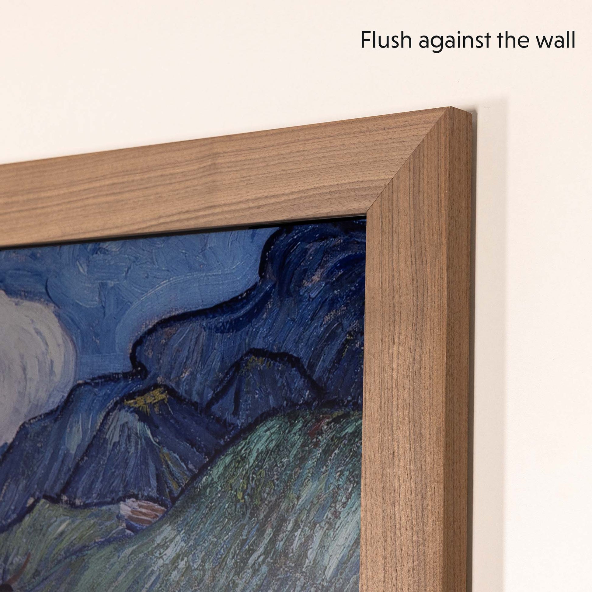 Mounted walnut tv bezel on Samsung The Frame 65 inch TV flushes against the wall