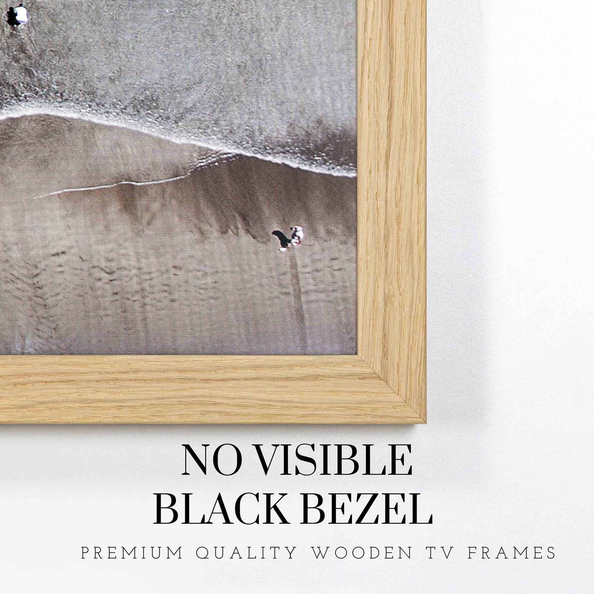 Thin oak TV frame fully covers tv's black bezel