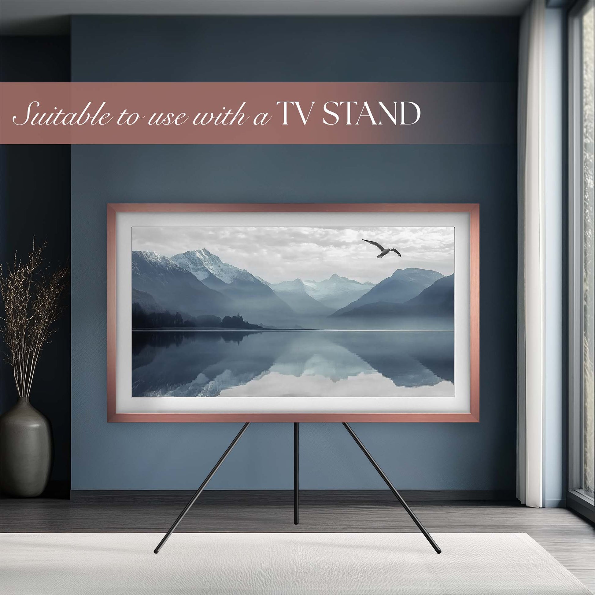 Gold copper rose gold TV placed on a TV stand in minimal elegant interior setting.