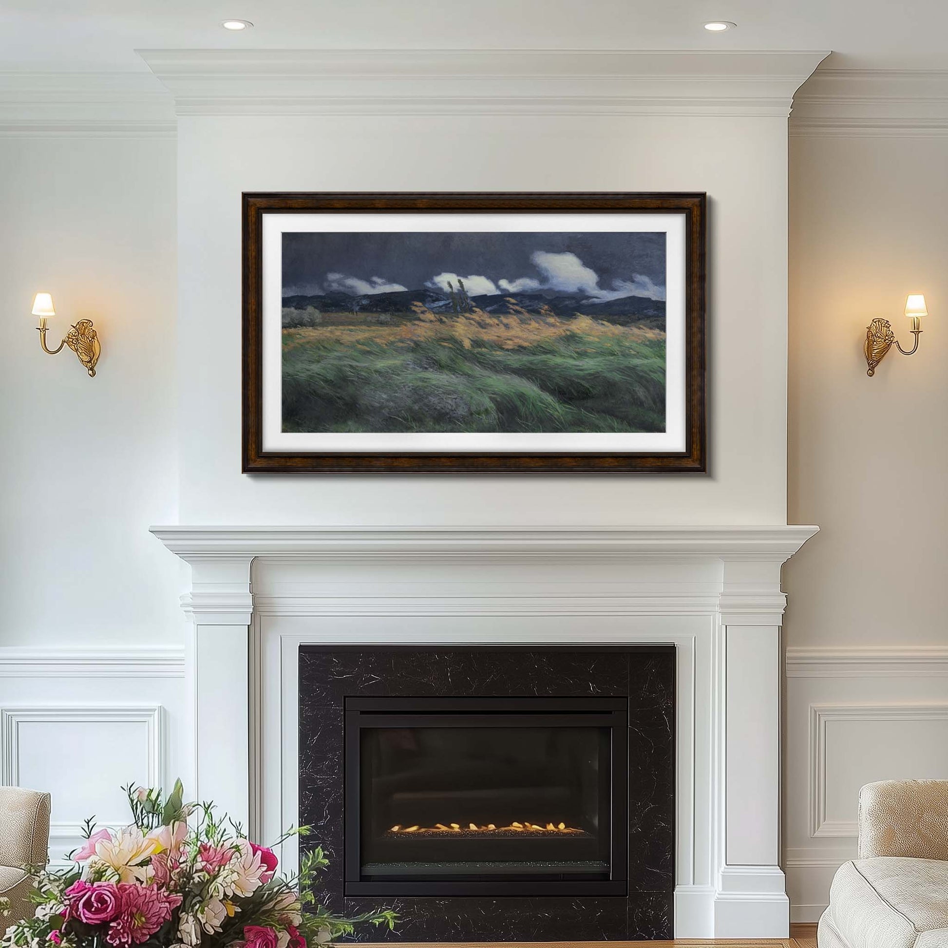 Dark brown tv frame 55 inch above a fireplace in a room with wall sconces and floral arrangement.