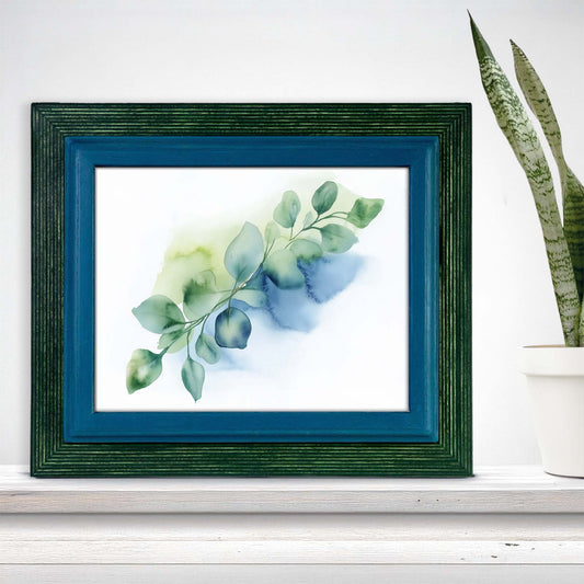 blue and green picture frame, blue picture frame, blue and teal watercolor botanical art, white distressed desk, white pot and green plant