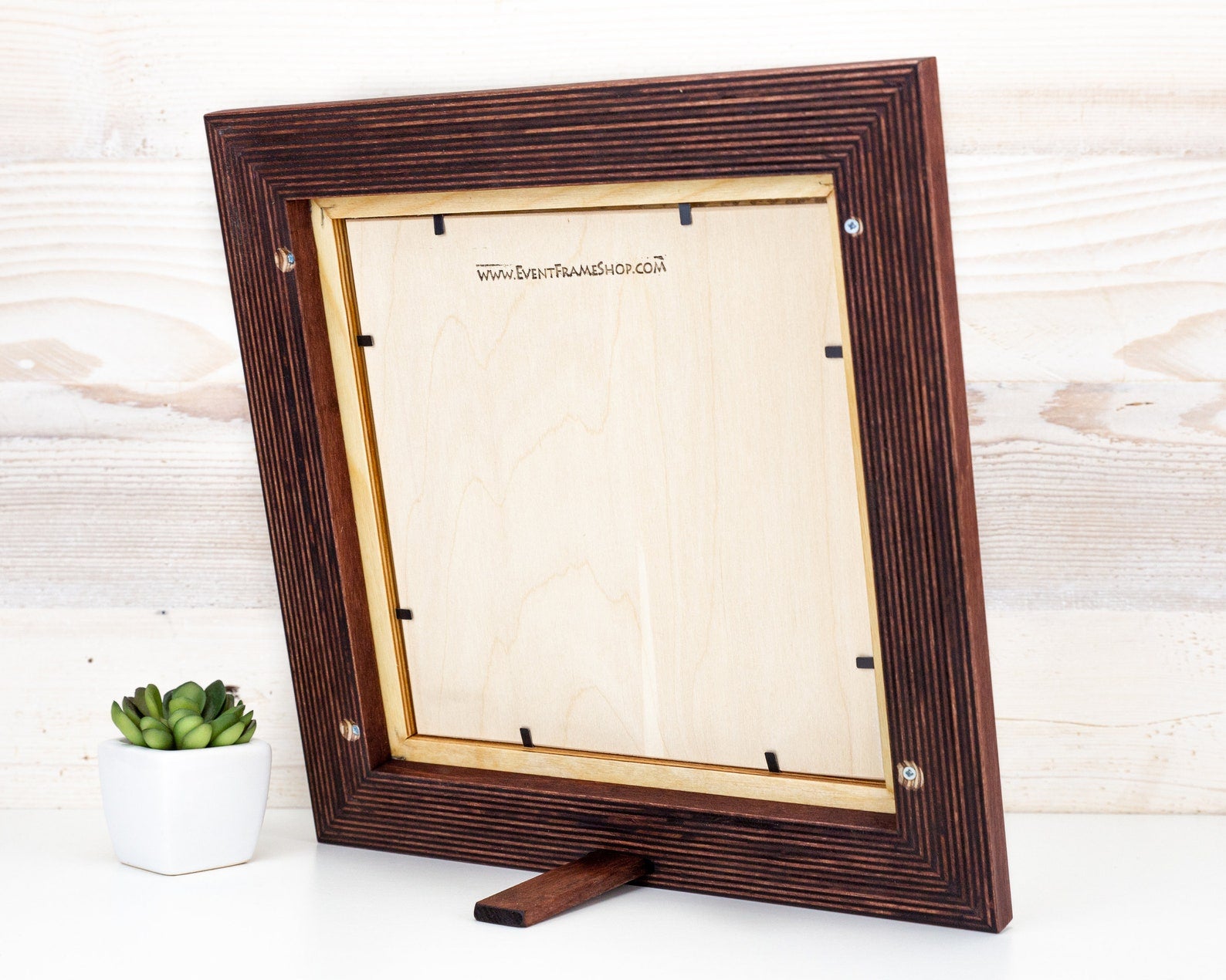 Wooden picture frame on a white surface with a light wooden background. Brown + Natural Photo Frame, Wood Picture Frame, Gallery Wall Frames, Custom Size 5x7 8x10 10x10 8x12 8.5x11 11x14 12x18 18x24 20x30 A1 A2