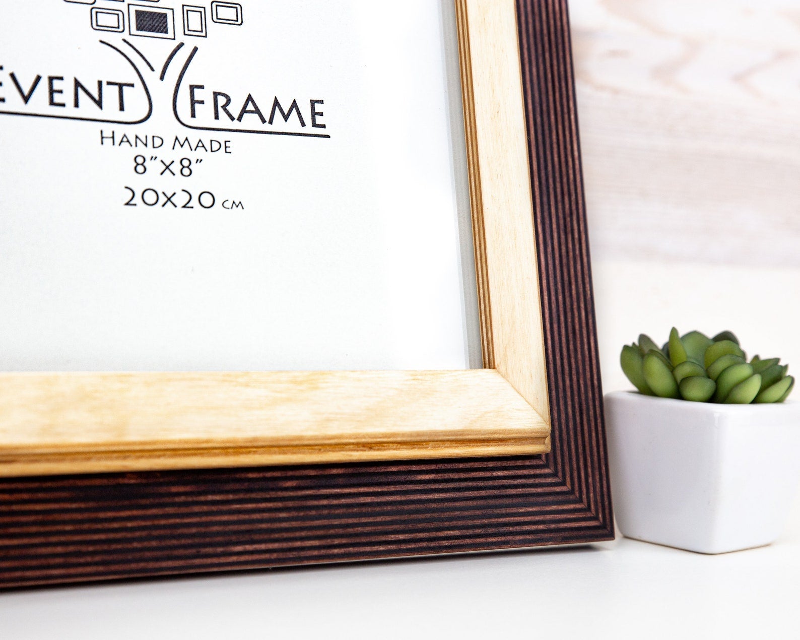 Wooden picture frame with 'Event Frame' branding on a white surface. Brown + Natural Photo Frame, Wood Picture Frame, Gallery Wall Frames, Custom Size 5x7 8x10 10x10 8x12 8.5x11 11x14 12x18 18x24 20x30 A1 A2