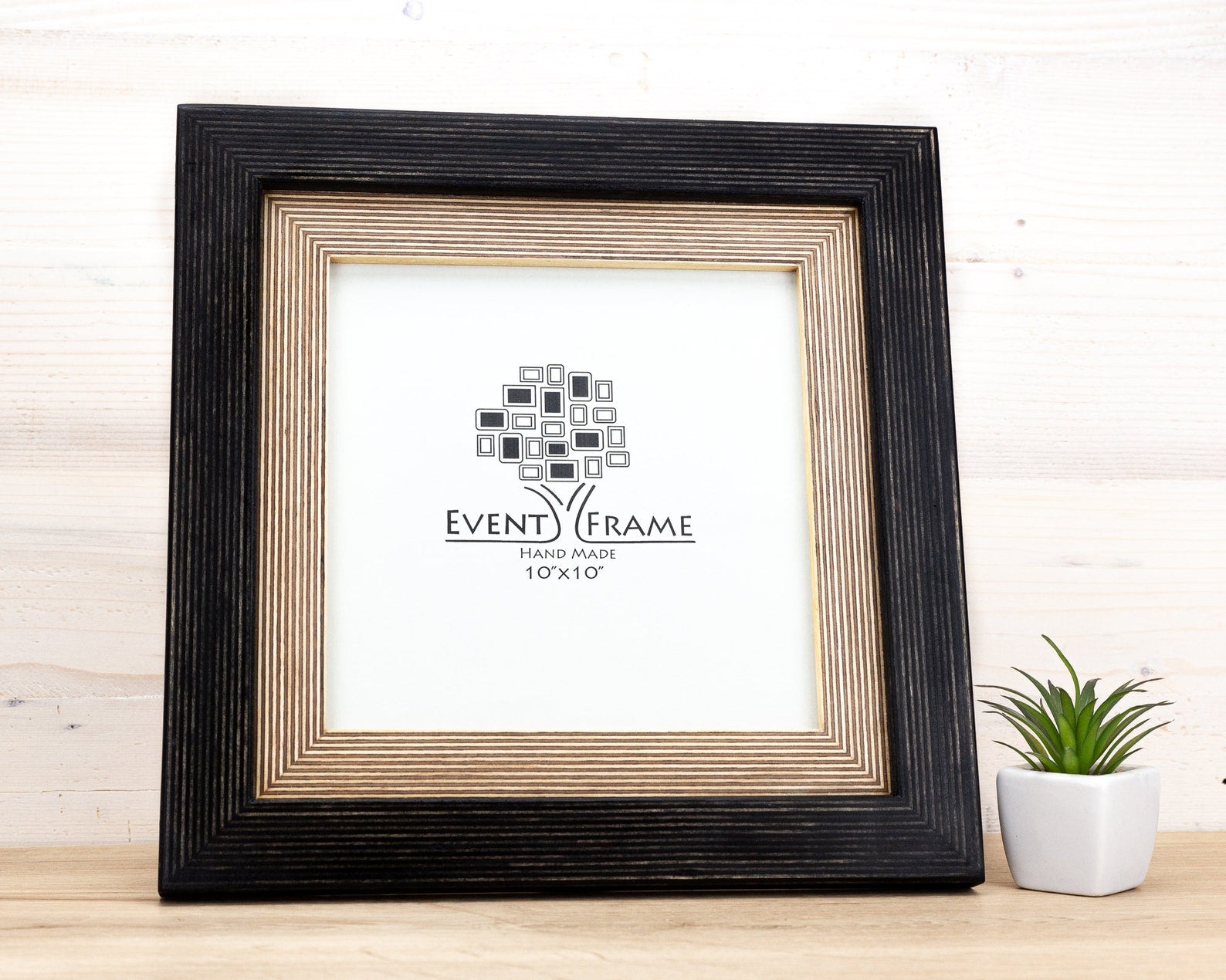 Black picture frame with a white center displaying 'Event Frame' logo on a wooden surface. Handmade Black + Natural Picture Frame, Rustic Photo Frame with Wooden Mat, Any Custom Size A4,A3,A2, 5x7, 8x10, 12x18, 16x20, 18x24, 24x36