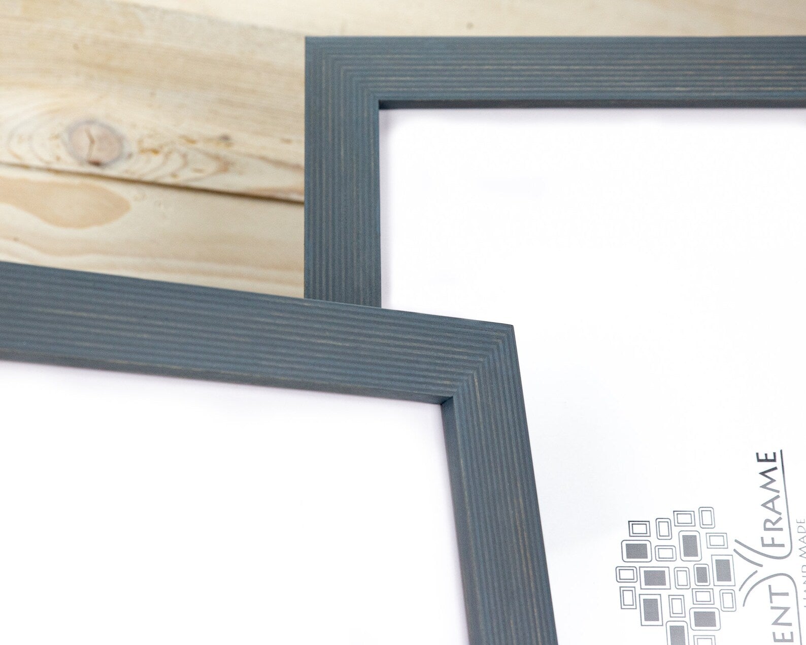 Two gray picture frames on a wooden surface with 'Event Frame' logo in the corner. Grey Wooden Picture Frame, Handmade Custom Size Photo Frame, Stripy Design Poster Frame A1 A2 5x7 10x10 8x10 12x18 16x20 18x24 20x30 24x36