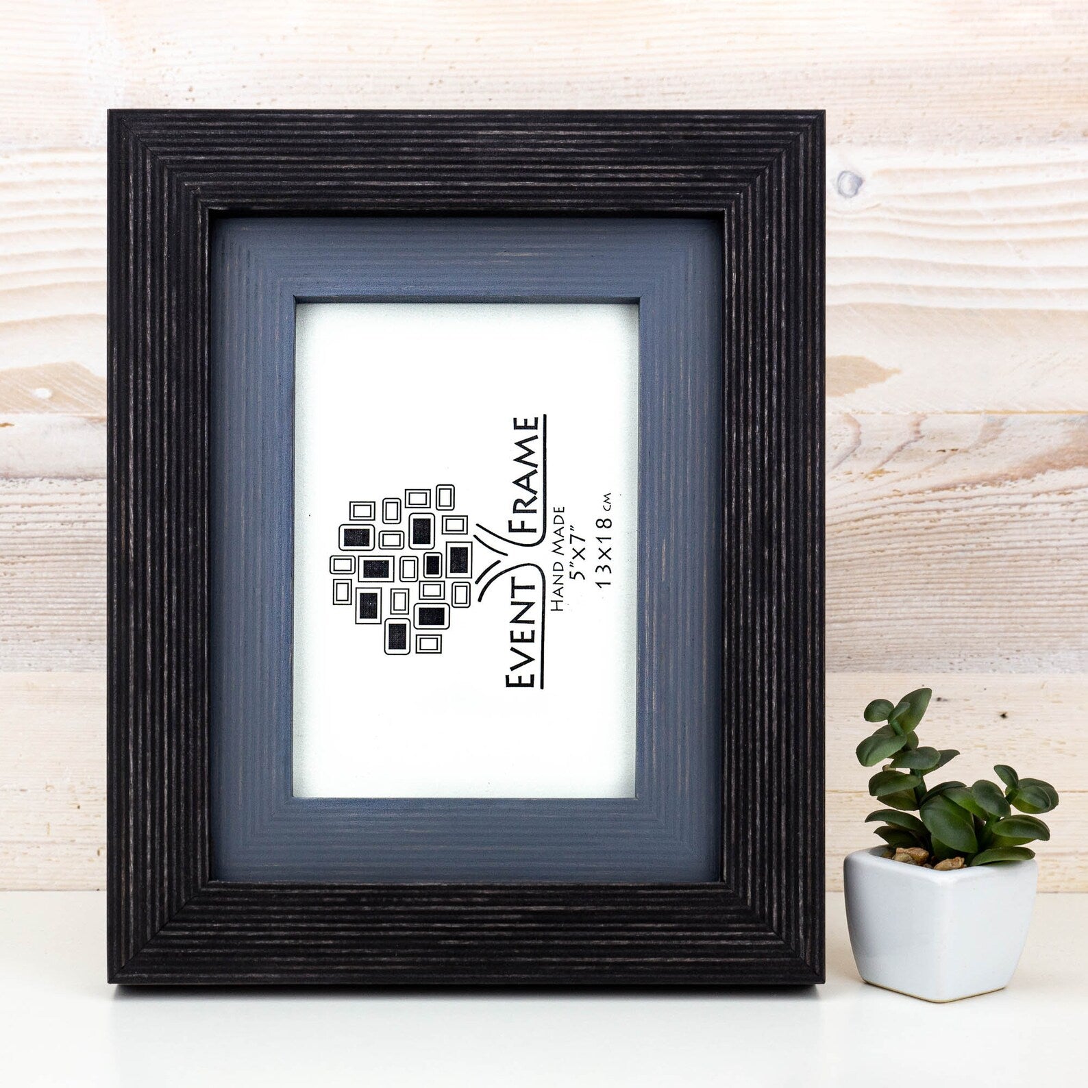 Black picture frame with 'Event Frame' branding on a wooden surface. Black + Grey Handmade Picture Frame, Photo Frame with Wooden Mat, Two Tone Poster Wall Frame, Custom Sizes A1 A2 5x7 8x10 18x24 24x36 20x30