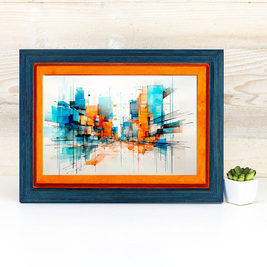 Framed abstract art with orange and blue colors on a white surface. Add rustic elegance with this grey + white birch frame. Handmade and built to last, ideal for artwork, photo décor, or Scandi-inspired homes.