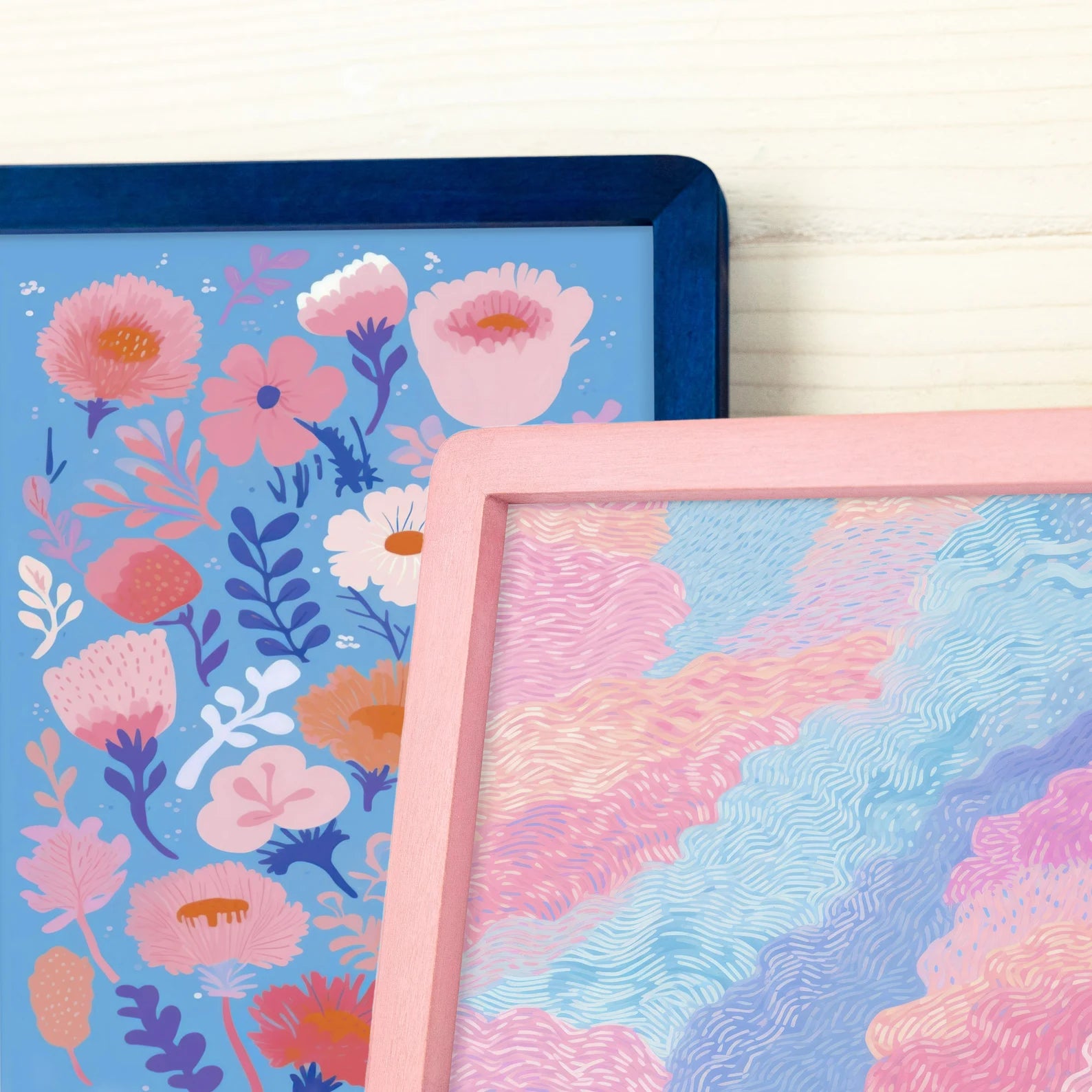 Blue and pink picture frames with colorful drawing designs.