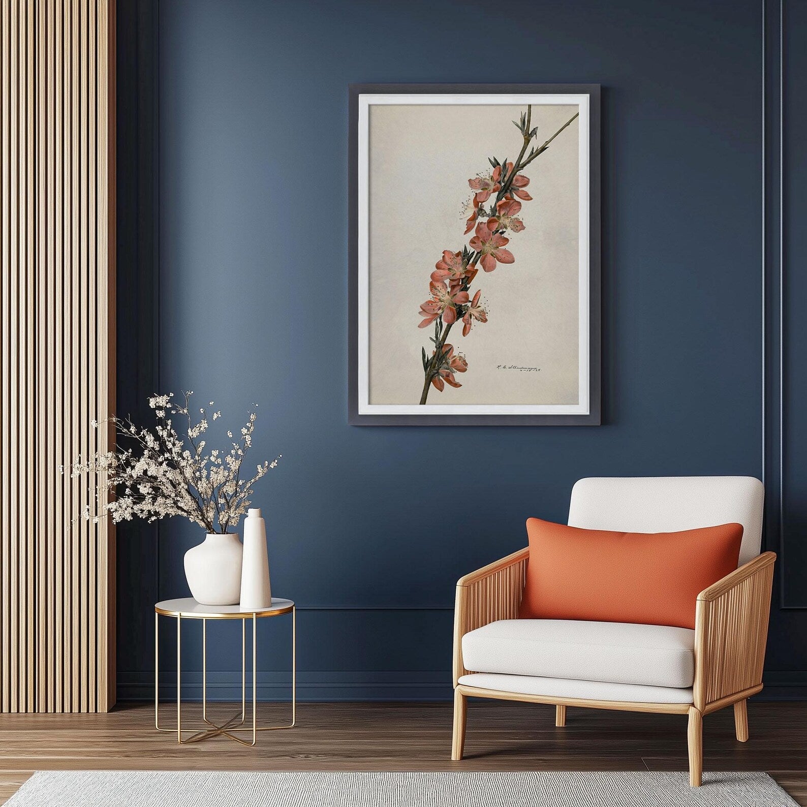 Modern living room with a framed floral print on a blue wall, a white armchair with an orange pillow, and a small round table with decorative items. Charcoal Grey + White Custom Size Frames, Double Color Frame for Poster, Handmade Wooden Photo Frame, Cold Tones A2 A3 11x14 22x22 36x42