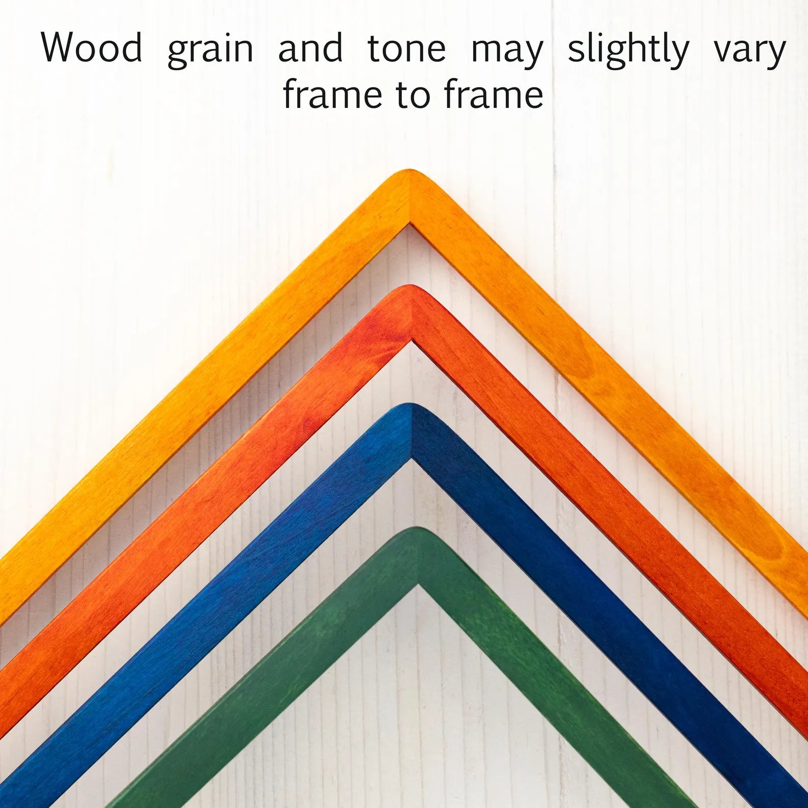 Corners of four picture frames in green blue orange and yellow with text "wood grain and tone may slightly vary frame to frame".