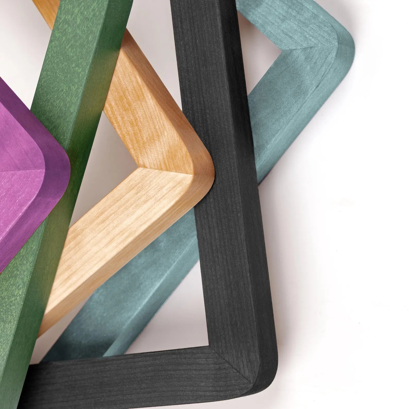Various wooden picture frames in purple green natural/beige black and teal colors.