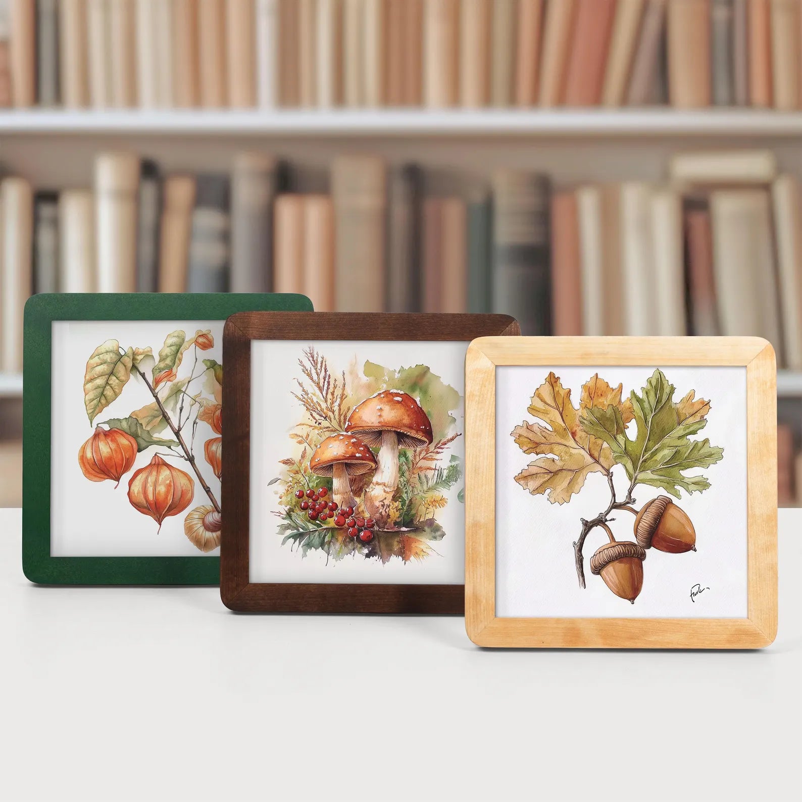 Green brown and beige natural wood picture frames in autumn fall theme in front of a bookcase.