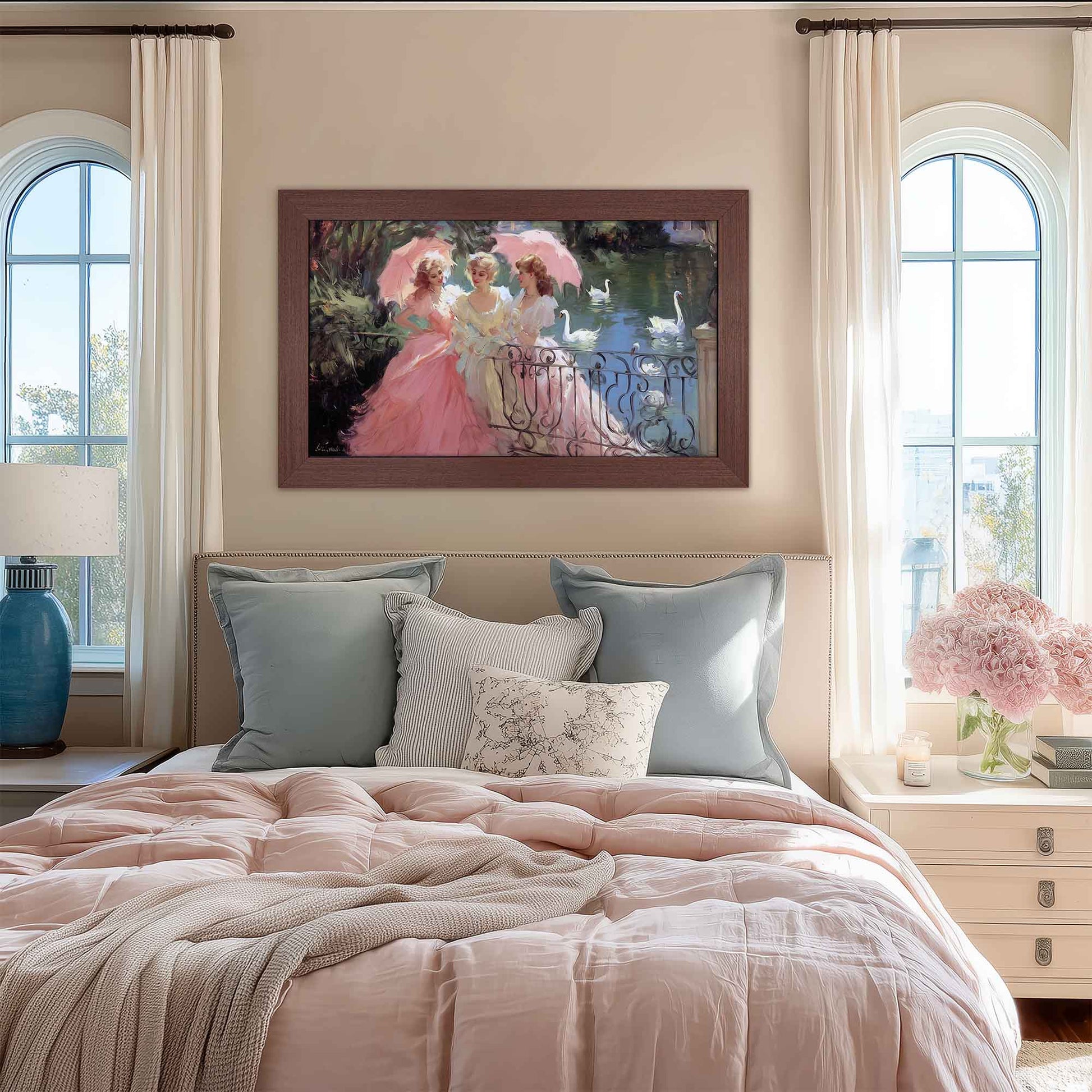 Bedroom with pink bedding, decorative pillows, and a framed painting on the wall.