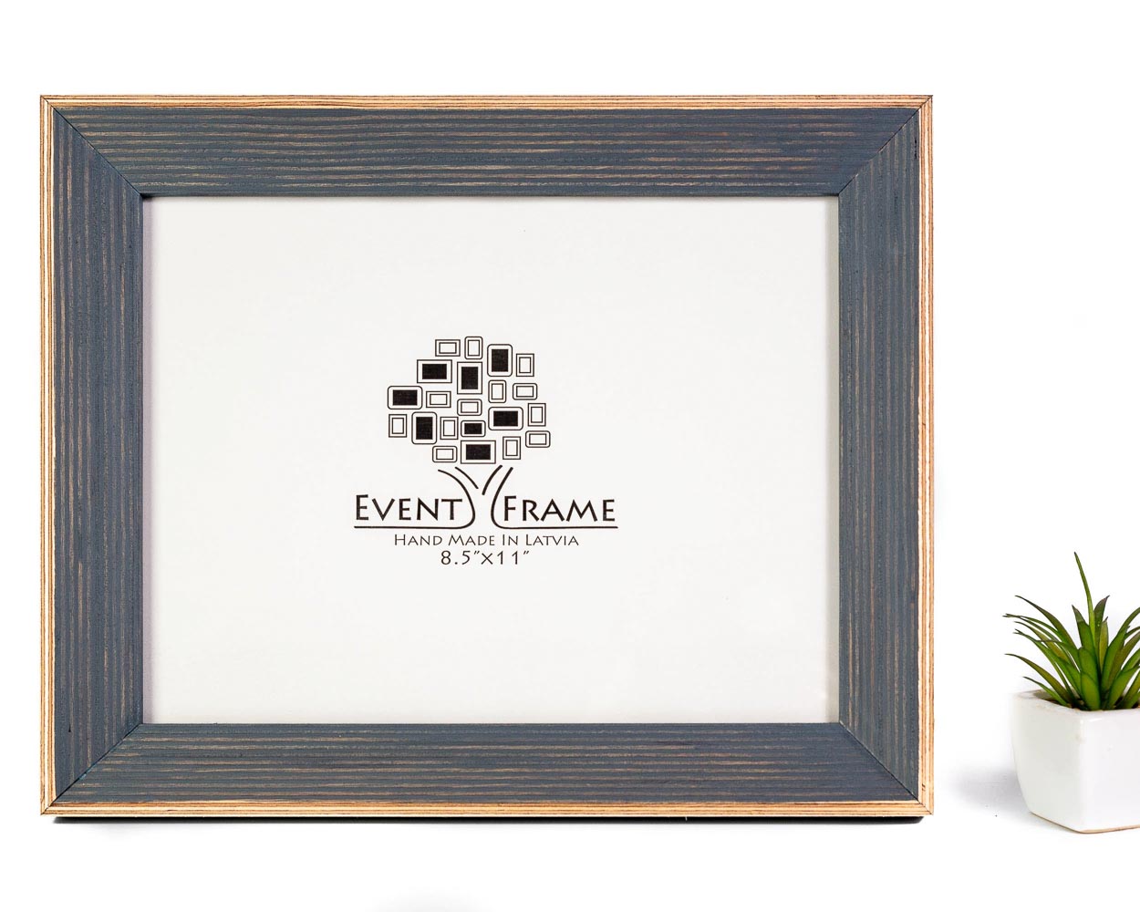 A classic grey photo frame made of solid birch hardwood, displayed with a white mat and a company logo in the center.