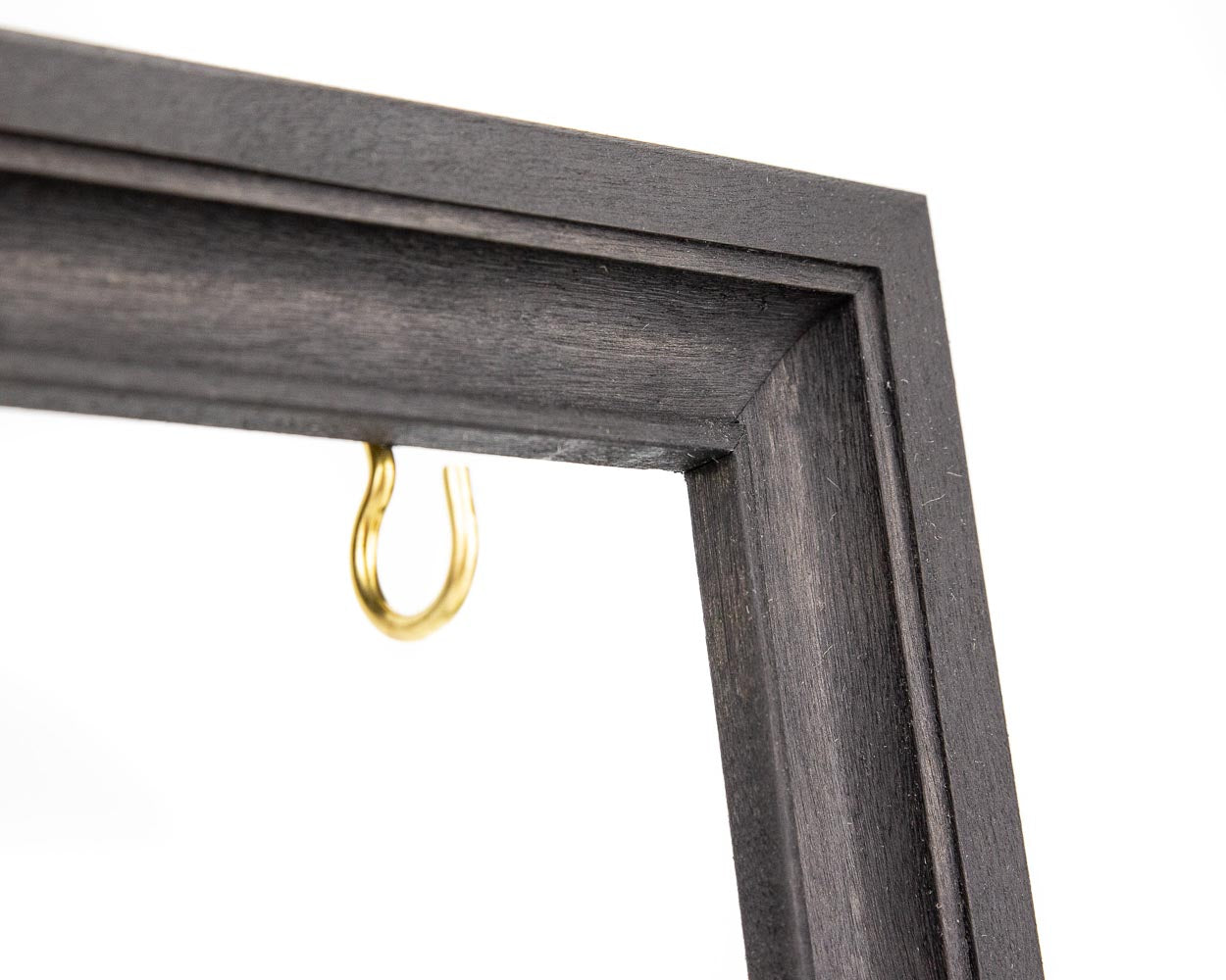 Black wooden frame with hooks for holding keys, accessories and jewelry.