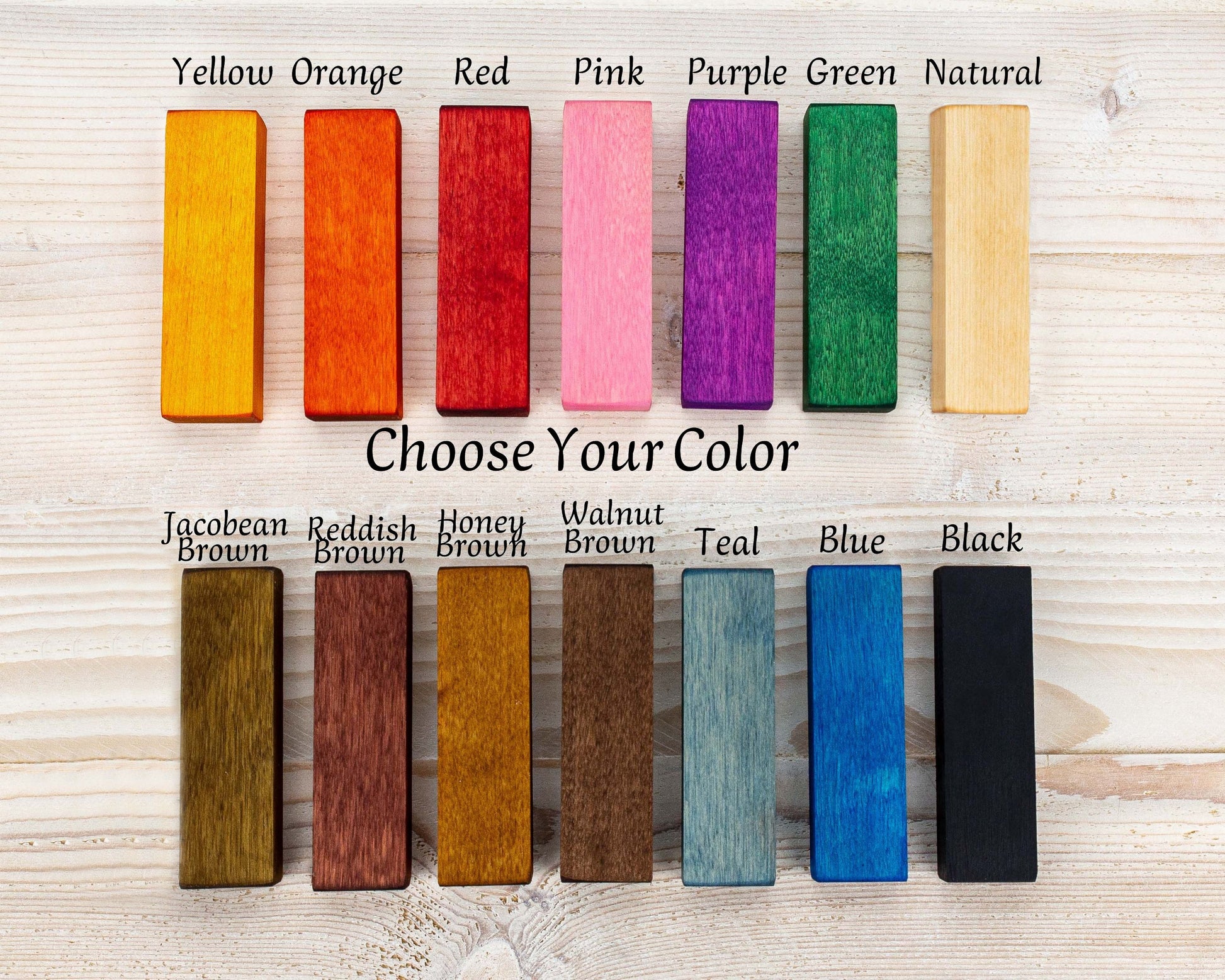 Colorful wooden frame samples in yellow orange red pink purple green natural brown teal blue black.
