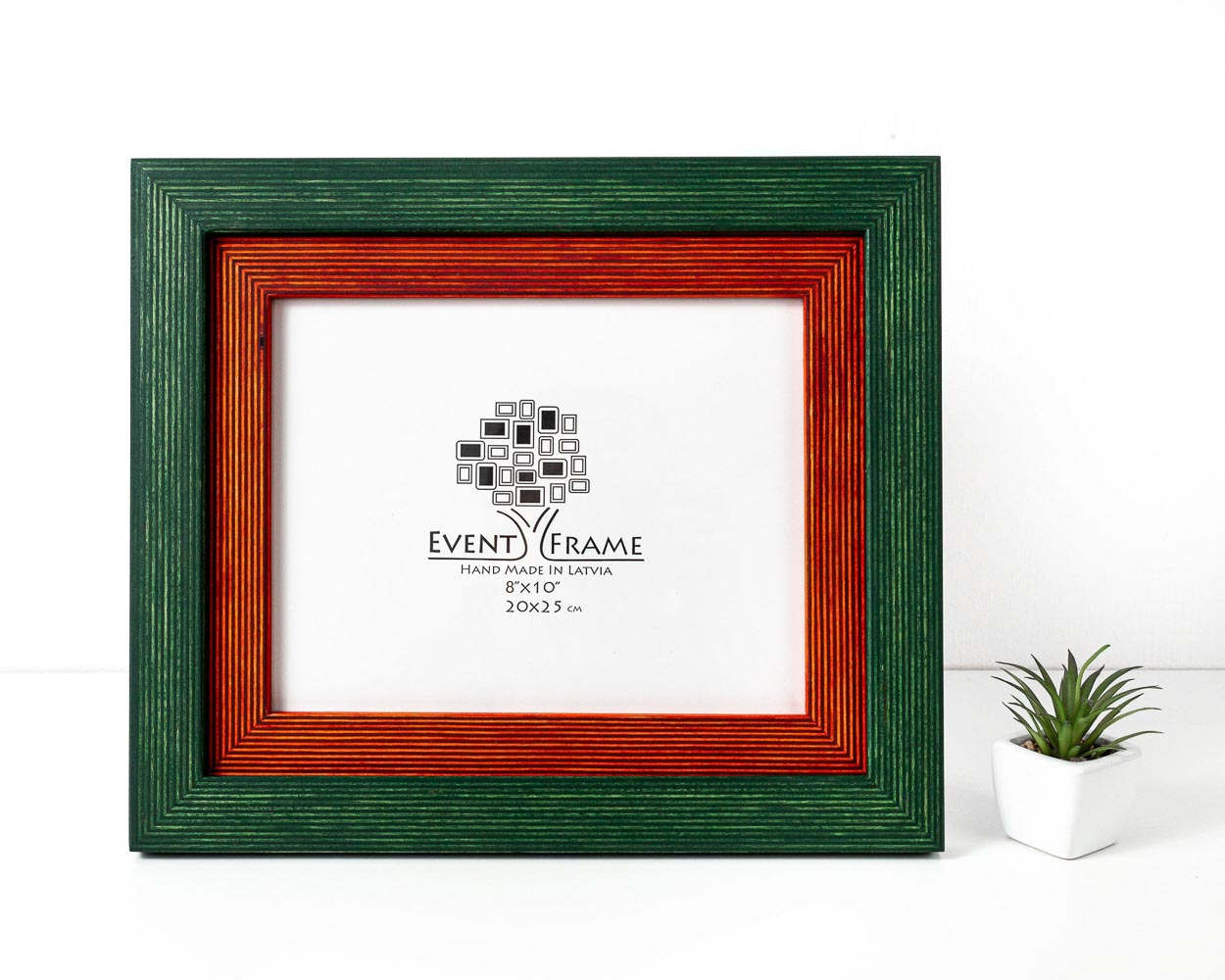 A double green and orange photo frame with a white inner picture, displayed against a neutral background with a small green plant to the side. Green + Orange Picture Frame, Photo Frame with Wooden Mat, Two Tone Gallery Wall Frame, Handmade Poster Frame, Custom Sizes 8x10 24x36 20x30