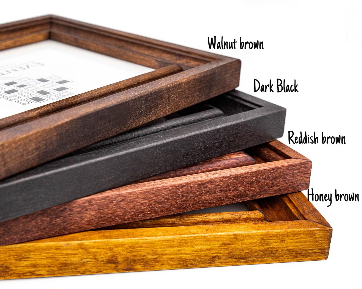 Different wooden picture frames in walnut brown, dark black, reddish brown and honey brown color. Handmade quality, made to last, custom sizing