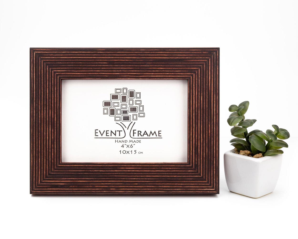 A brown solid birch hardwood picture frame with a stripy design, displayed alongside a small potted plant. Brown Picture Frame, Wooden Handmade Frame, Wall Decor Photo Frame A5 A4 A3 4x4 4x6 5x5 5x7 6x6 6x8 7x7 7x9 8x8 8x10 8x12 8.5x11 11x14 20x30