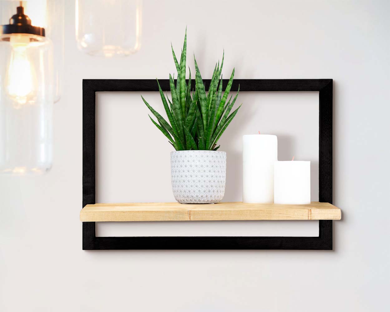Cozy simple wooden handmade framed shelf holding plant and candles for minimal home or office space.