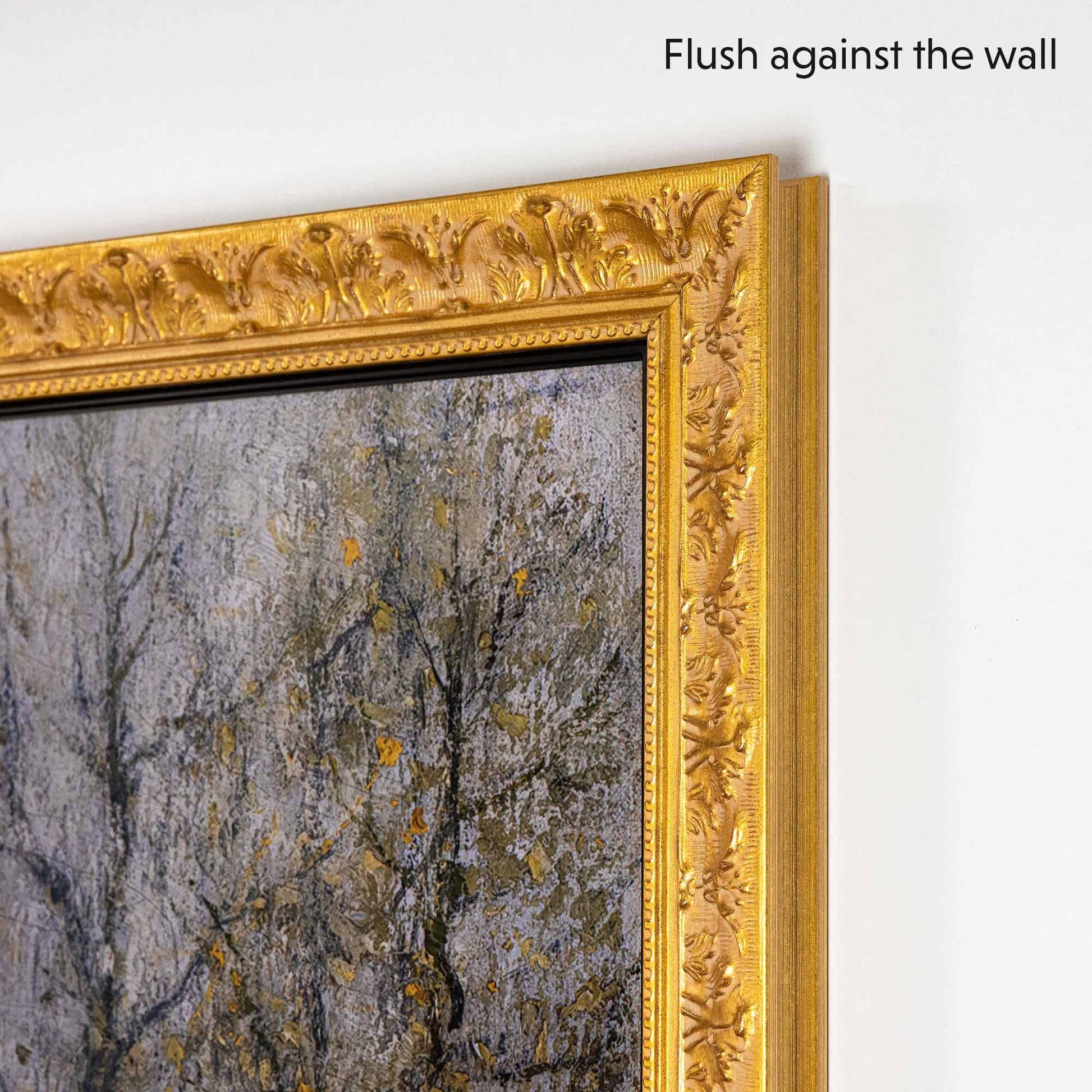Gold TV Frame with ornaments flushes against the wall