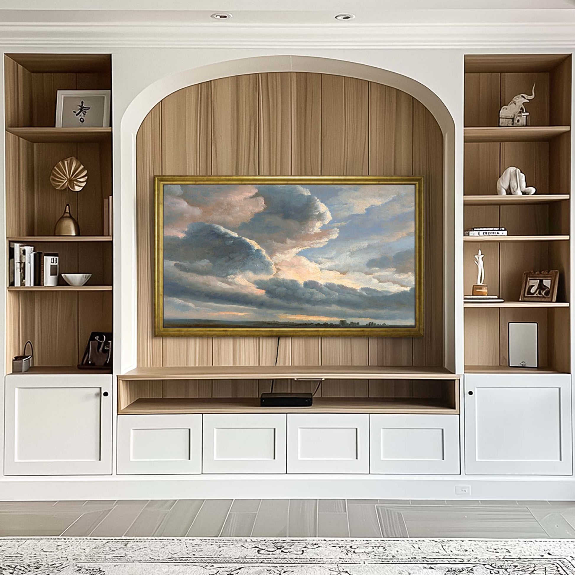 Gold TV frame in light interior, white cabinetry