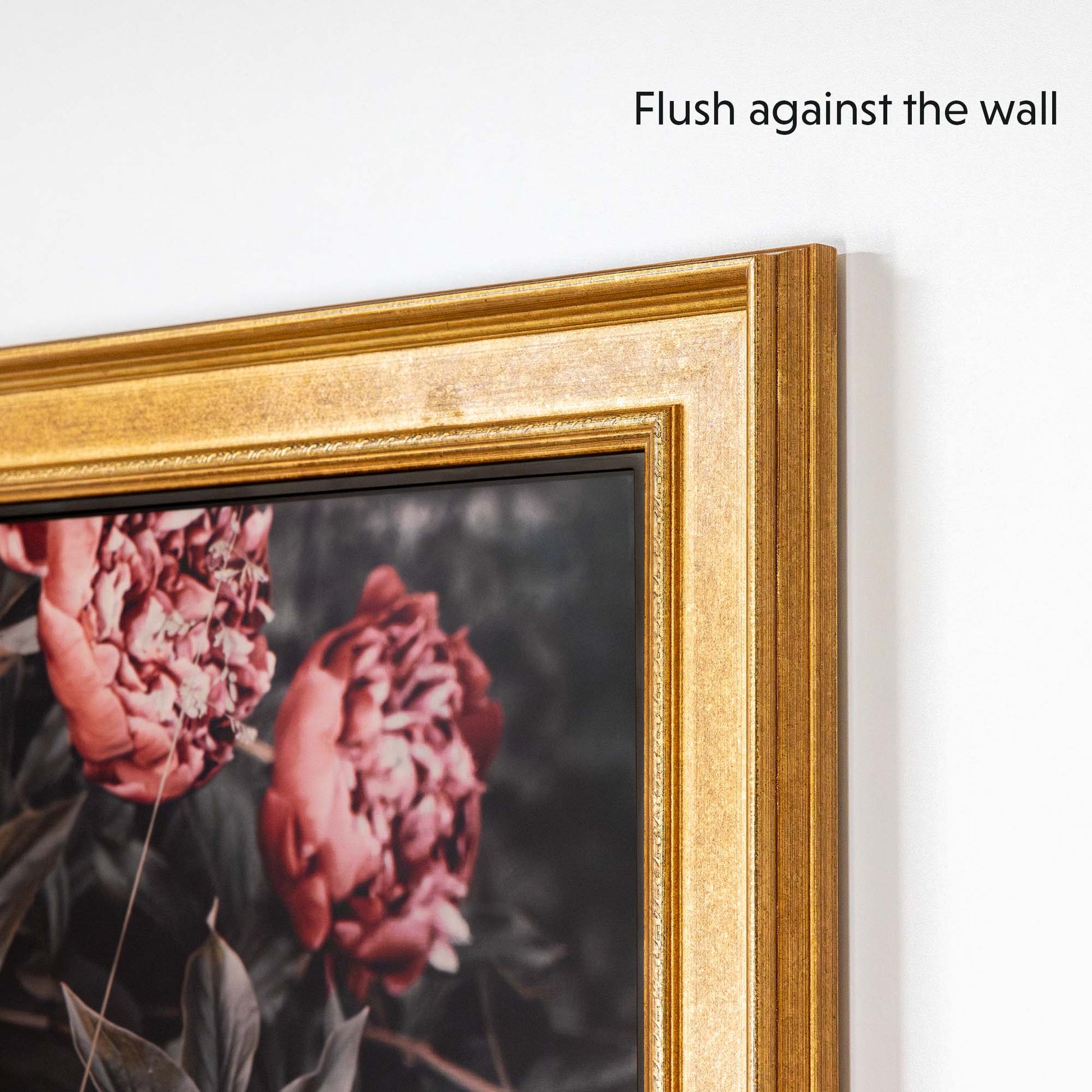 Gold tv bezel flushes against the wall when mounted on TV