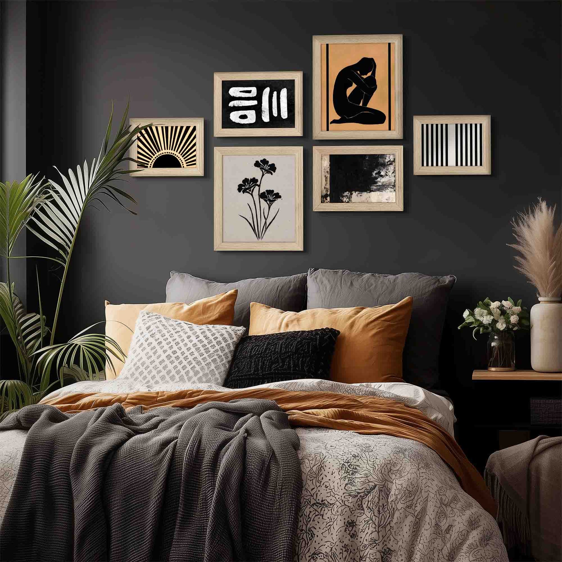 Decorative wall art above a bed with pillows and blankets in a bedroom setting.
