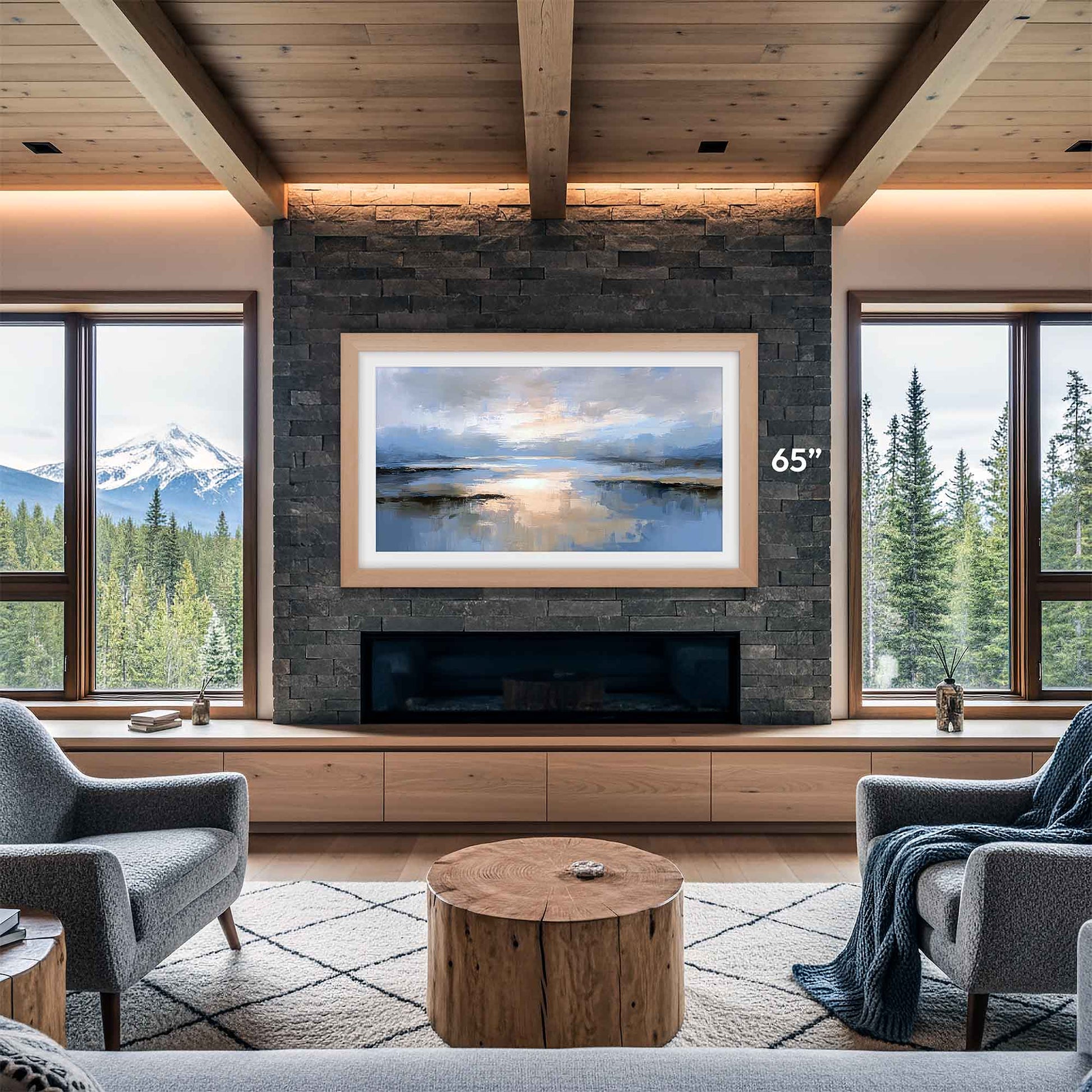 Modern living room with a large TV mounted on a stone wall, surrounded by windows with scenic views.