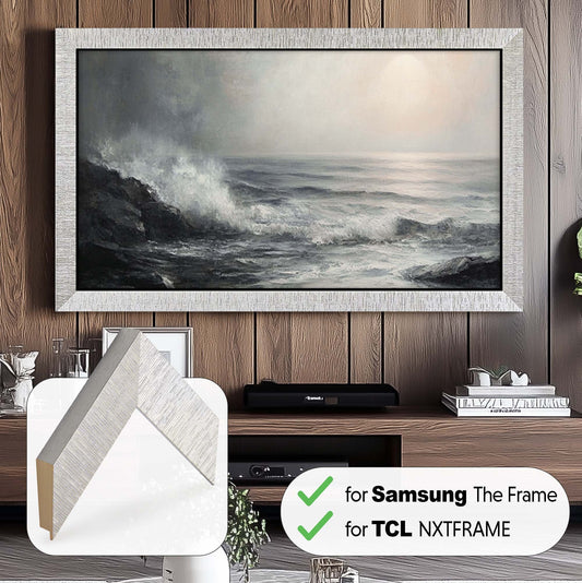 Modern silver tv frame for TCL NXTFRAME TV on the dark wood wall above a wooden tv console, in front small stone table, modern living room design with silver accents