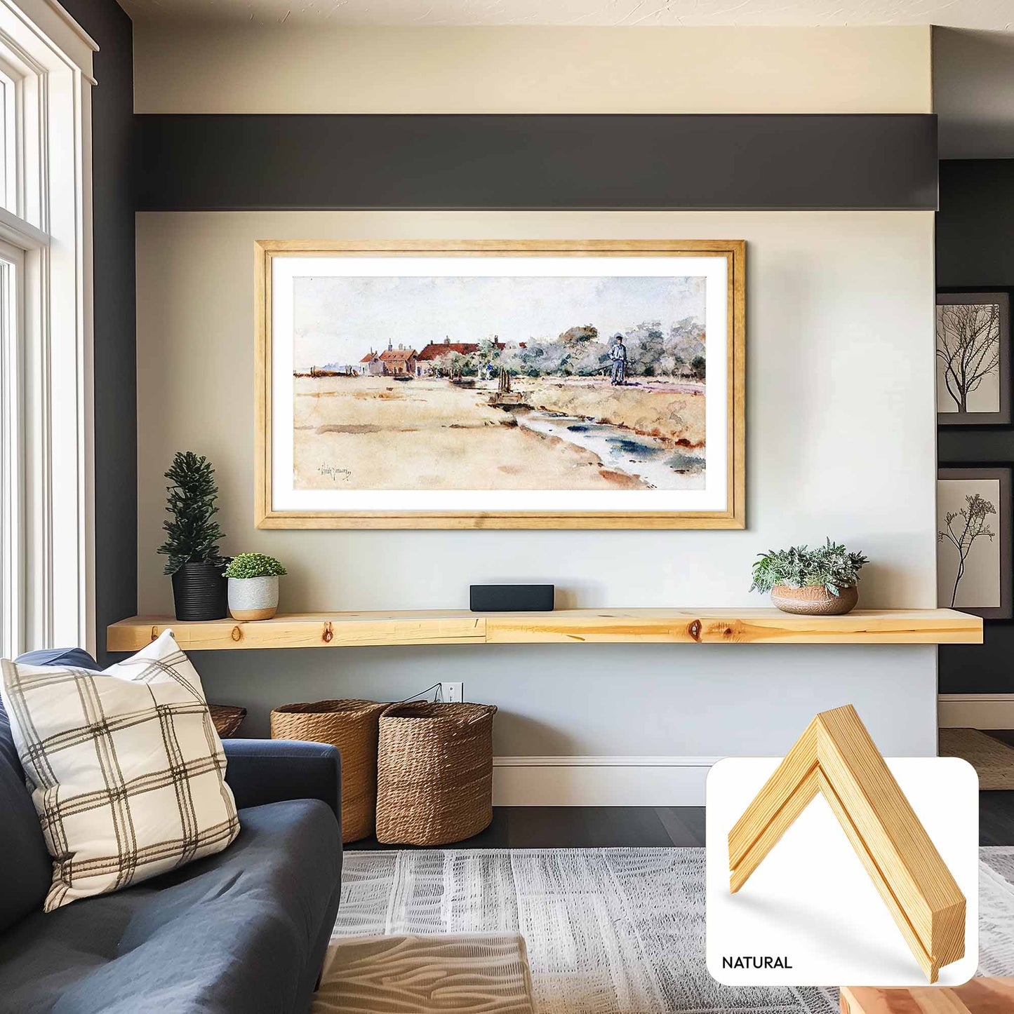 Living room with a framed artwork on the wall, sofa, and decorative items.