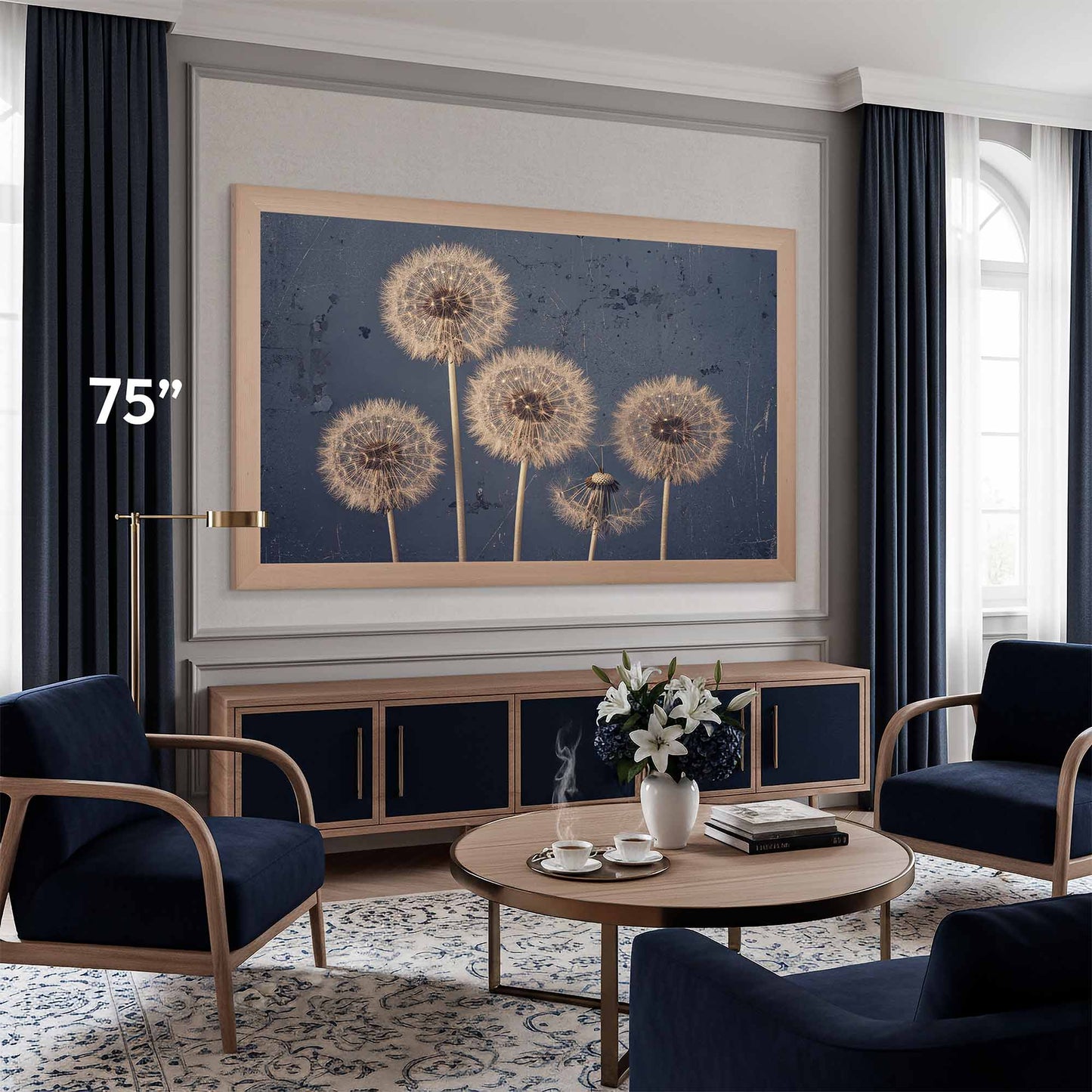 Living room with a Samsung The Frame Frame 75 with tv art dandelions on the wall, navy chairs, and a round coffee table.