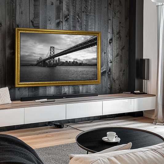 Ornate gold TV frames on black wooden accent wall