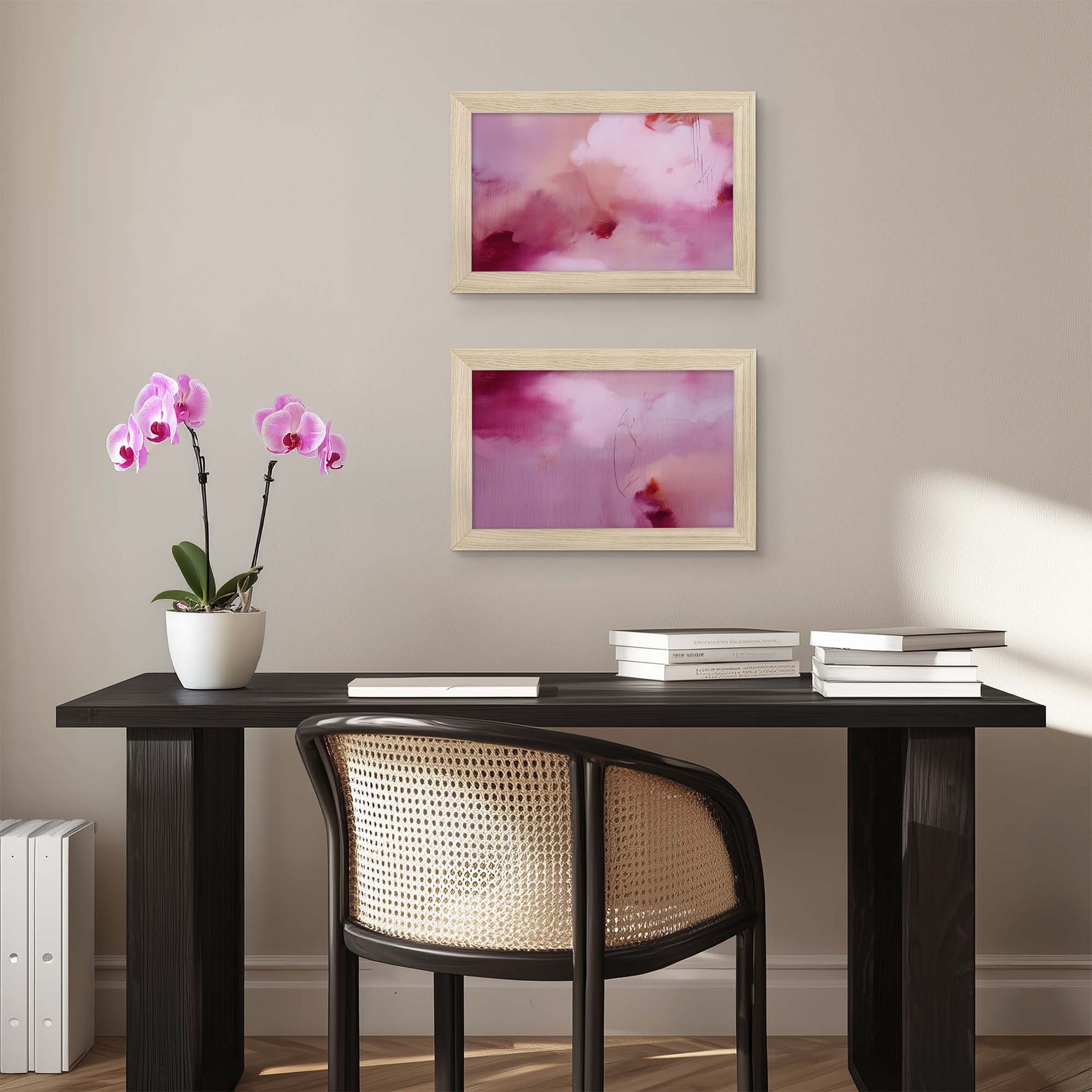 Modern office setup with a desk, chair, and framed artwork on a beige wall.