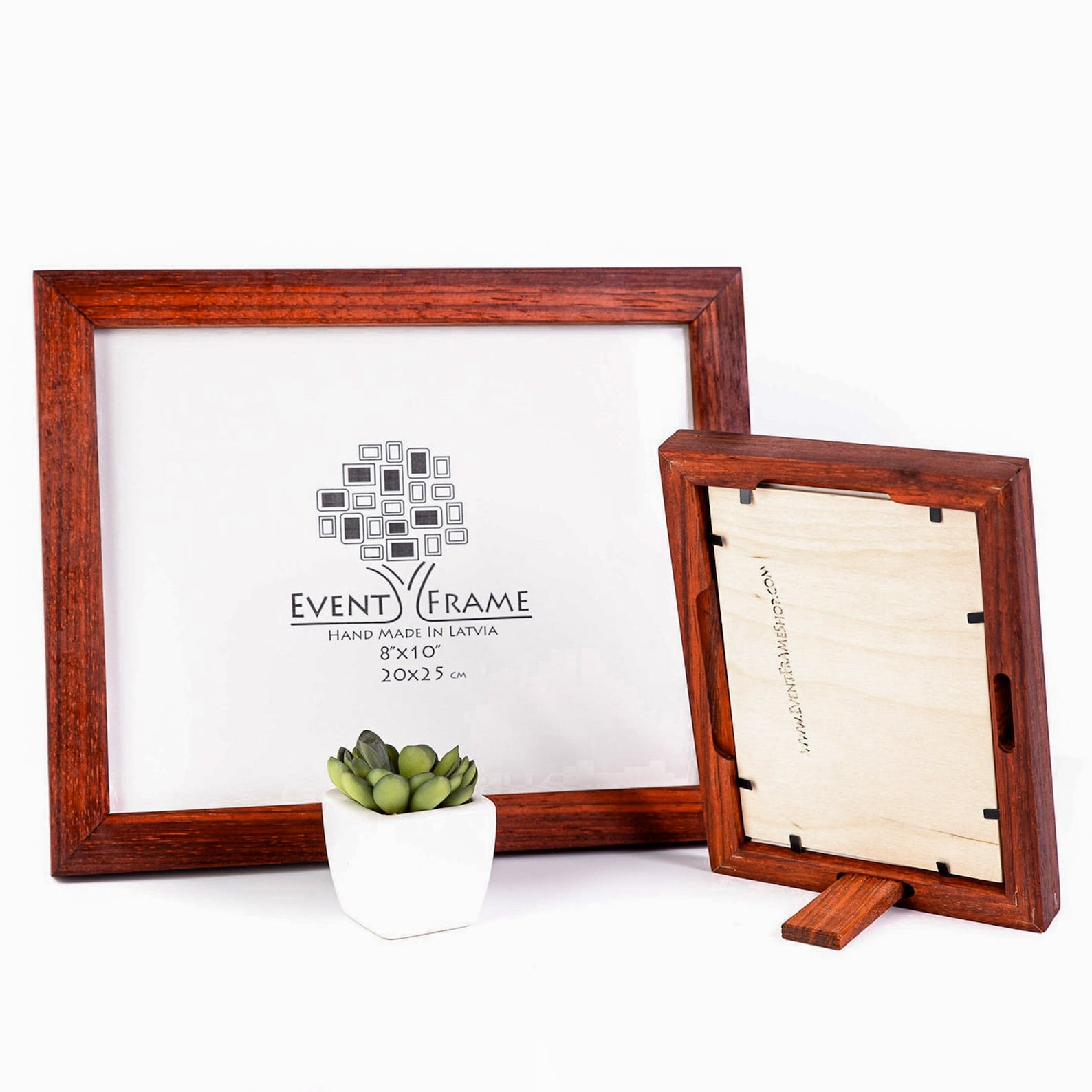 Two wooden picture frames with 'Event Frame' branding on a white background. Handmade alder hardwood frame with rich brown tones and red accents. Finished in natural oil, it adds warmth and charm to your artwork or photos.