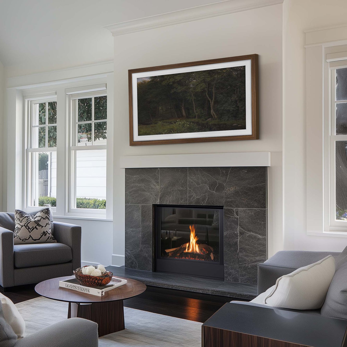 transitional living room with a standard stone fireplace and a wall-mounted tv