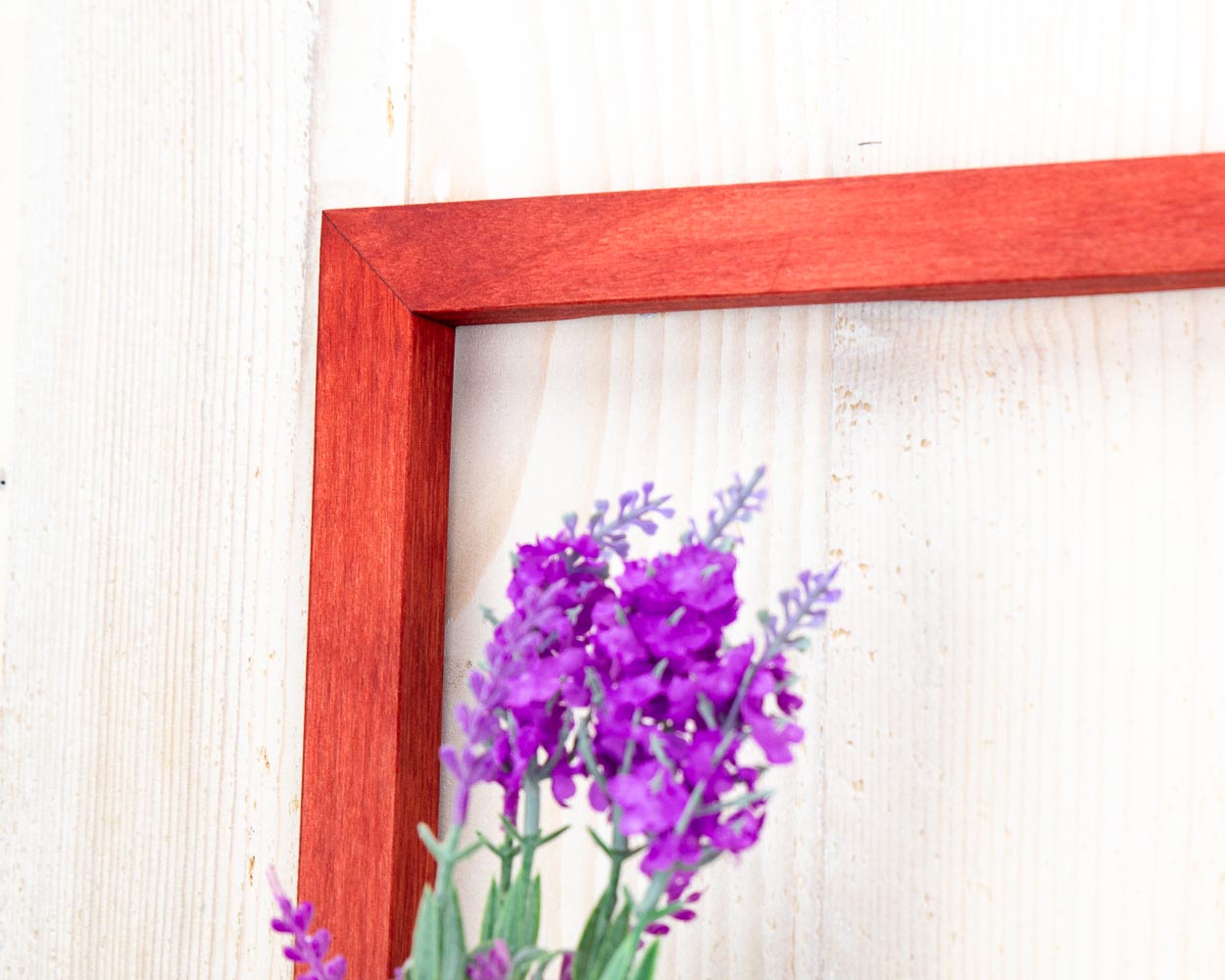 Red wooden floating framed shelf.