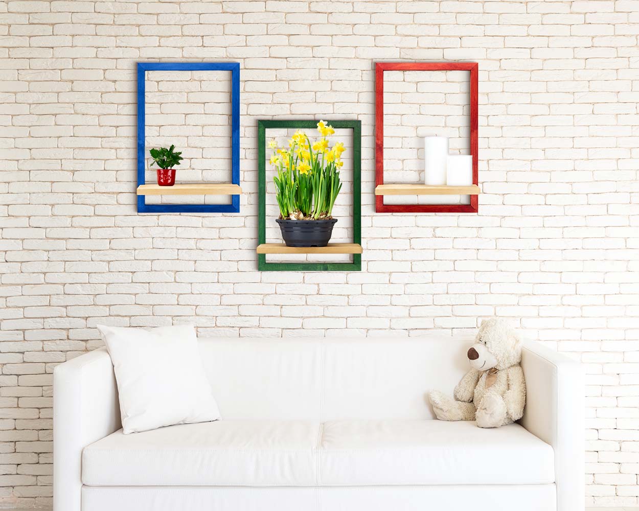 Colorful wooden storage framed shelves in cozy minimal home room holding plants and candles. 