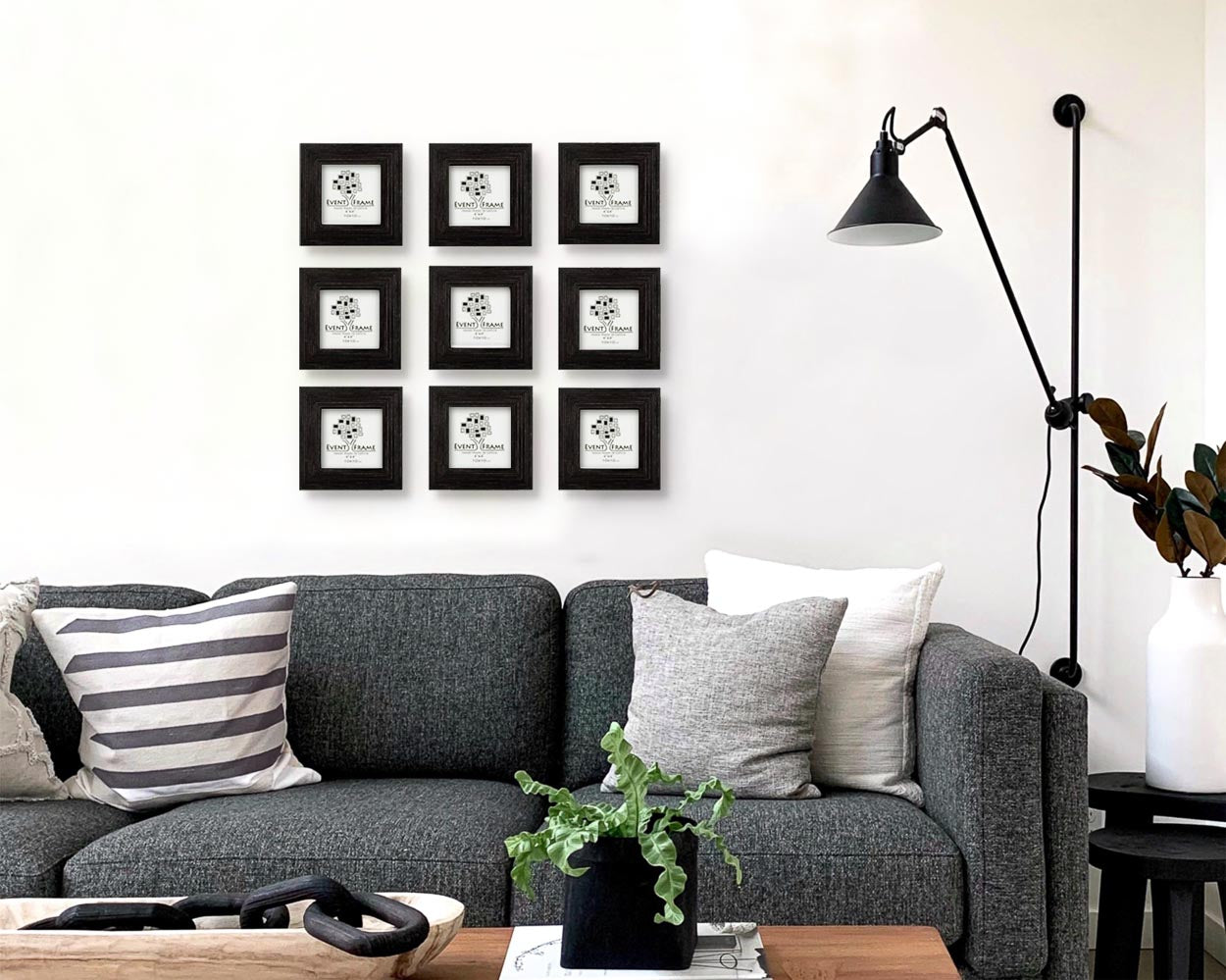 Black custom square wooden collage picture frame set in industrial minimalistic home.
